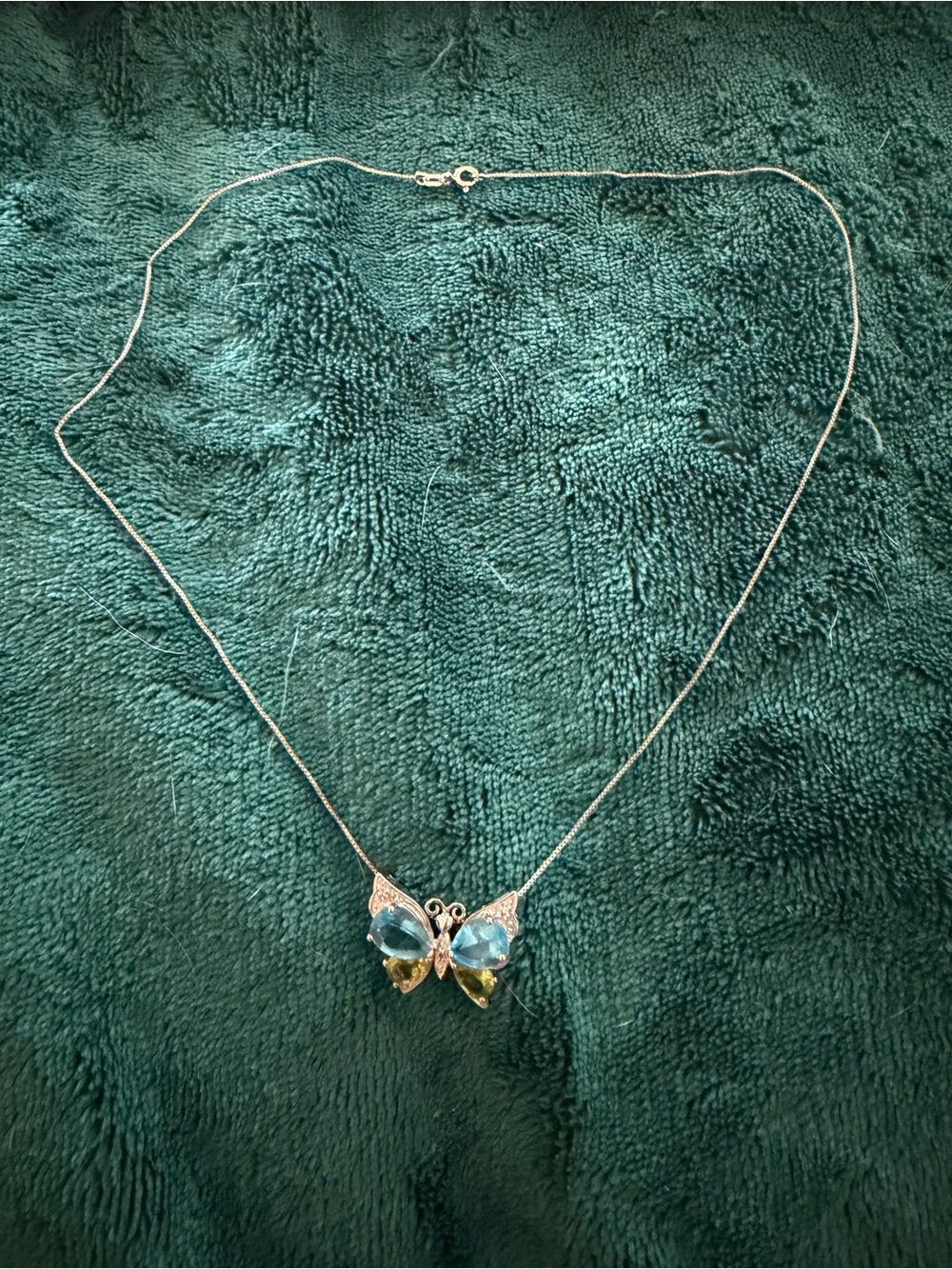 Sterling silver butterfly pendant with topaz and peridot gemstones
